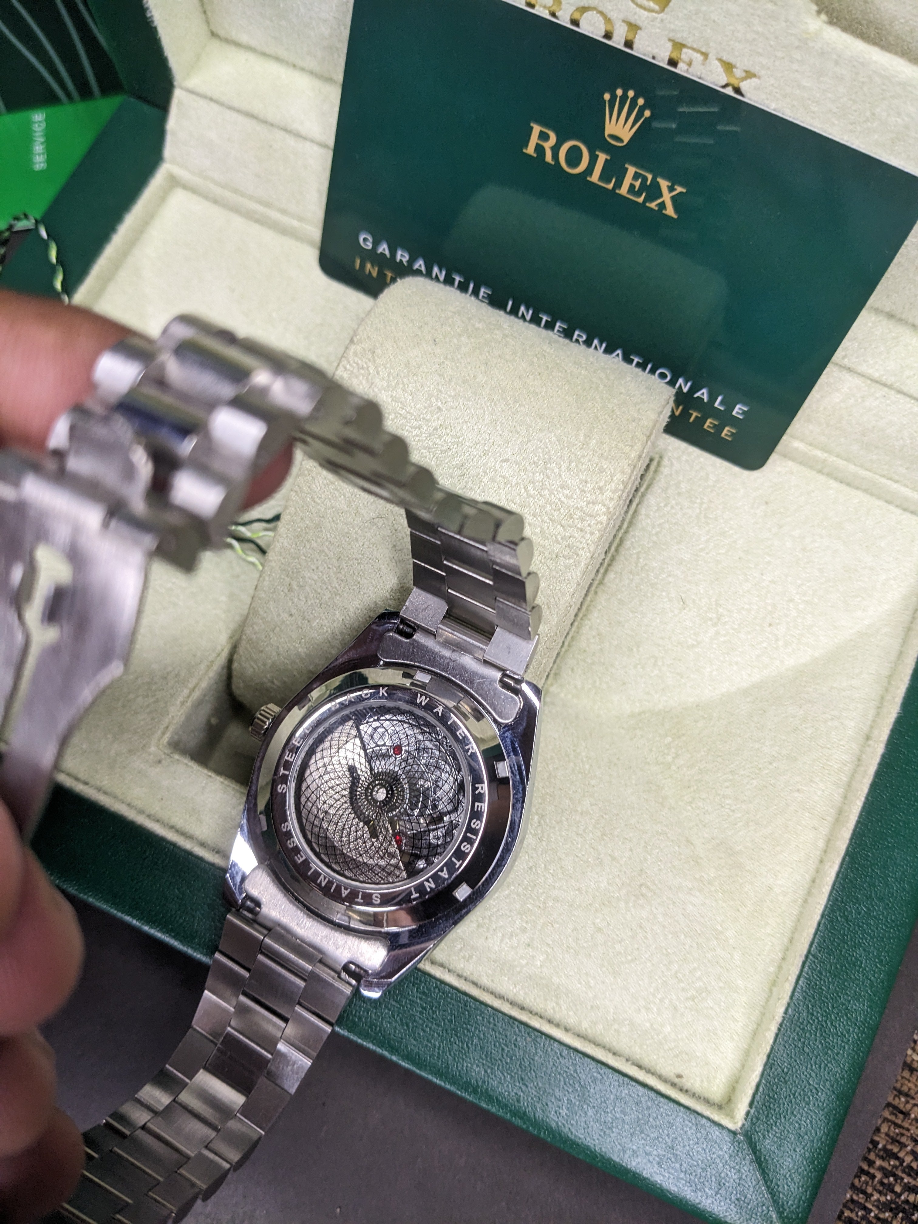 Rolex automatic movement silver with red dial