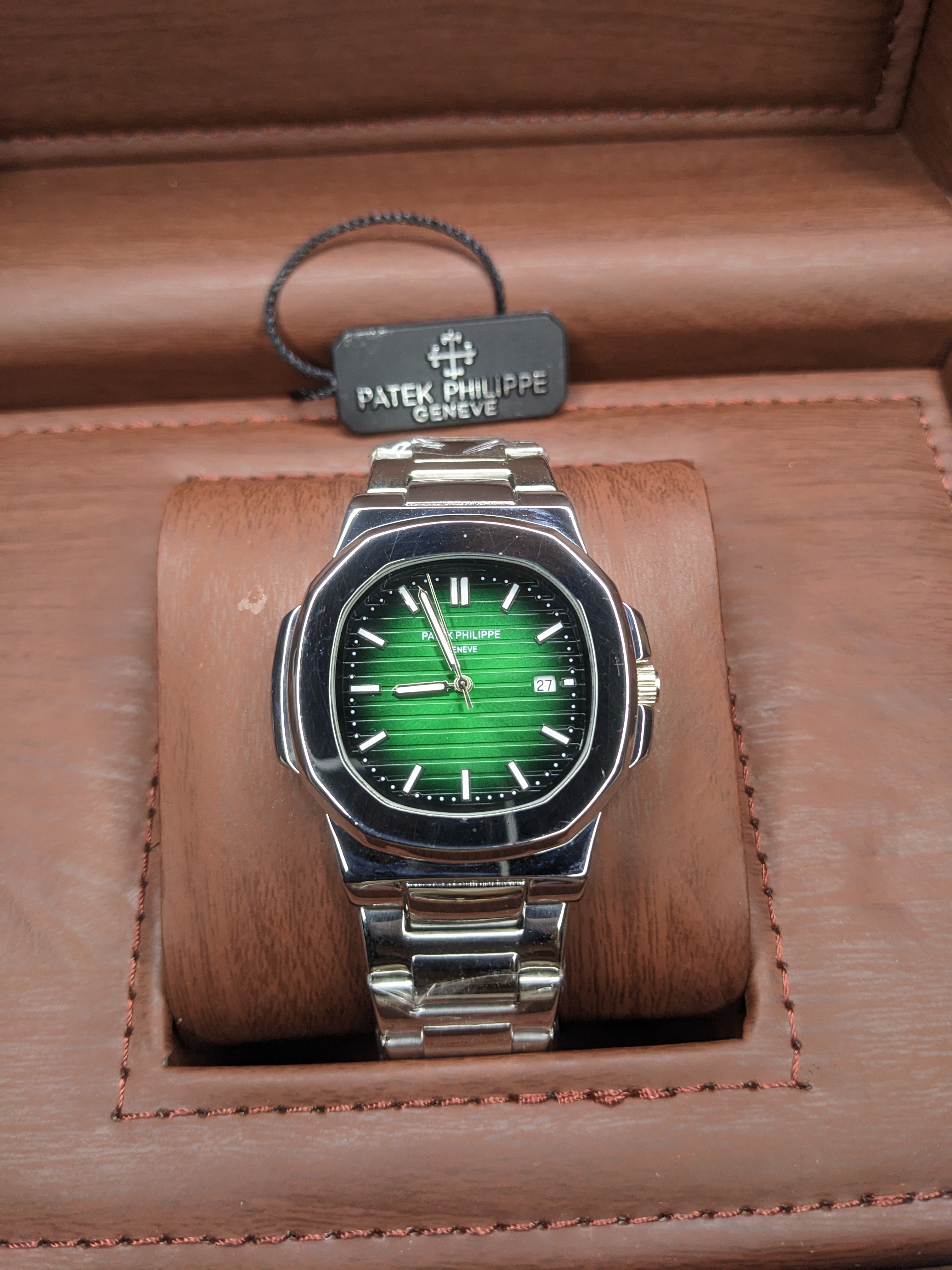 Patek philippe stainless steel With a green dial.