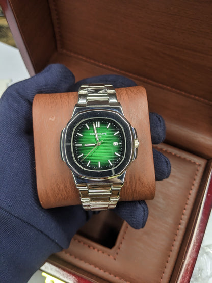 Patek philippe stainless steel With a green dial.